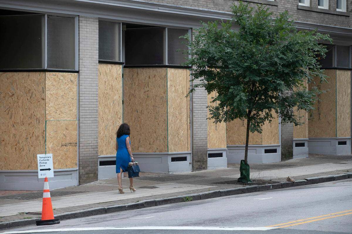The windows of Cafe Luna on E. Hargett Street are boarded up on Monday, August 31, 2020.