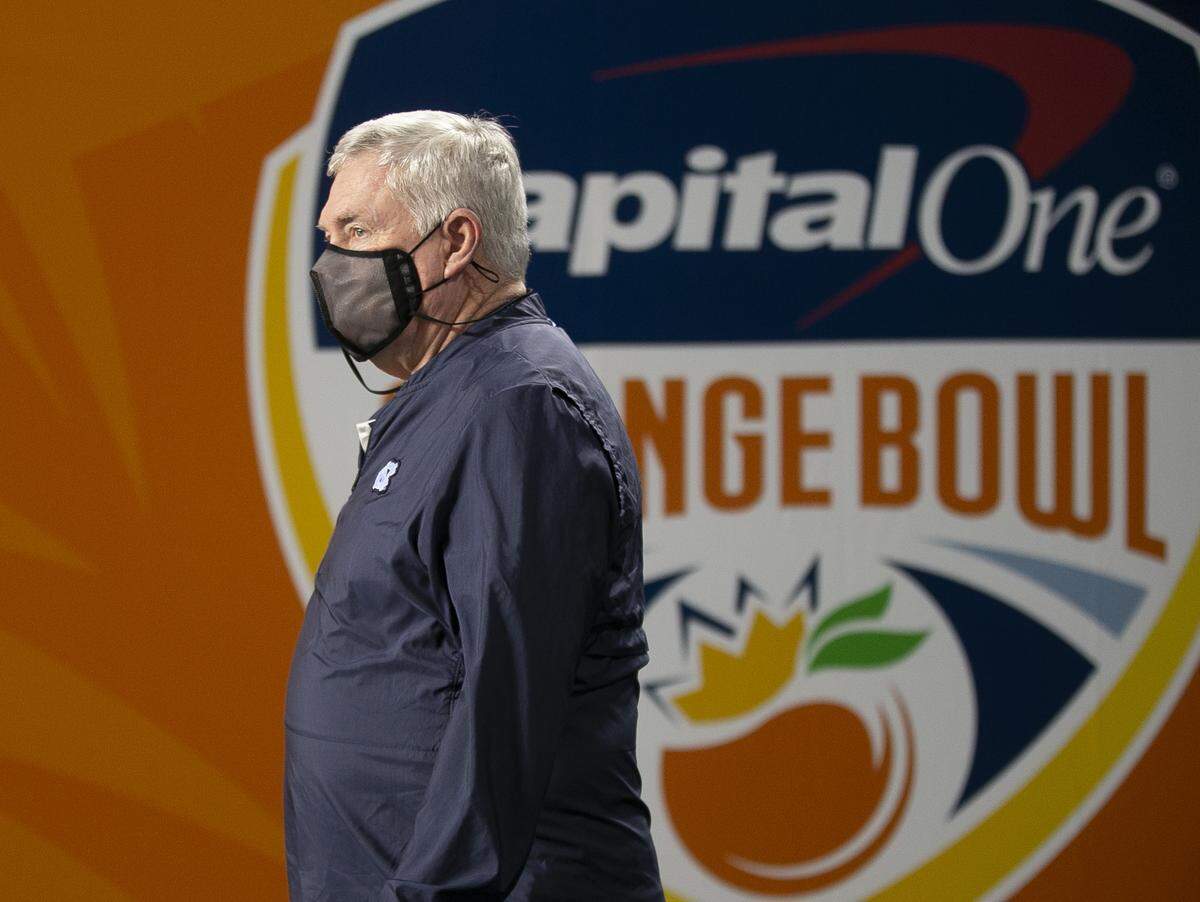 North Carolina coach Mack Brown enters Hard Rock Stadium for the Tar Heels’ game against Texas A&M in the Capital One Orange Bowl on Saturday, January 2, 2021in Miami Gardens, Florida.