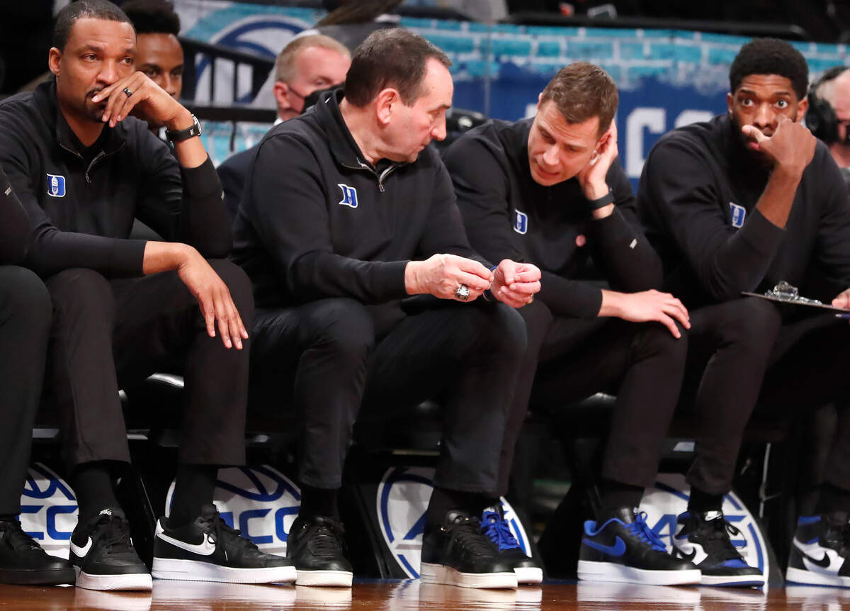 Duke head coach Mike Krzyzewski talks with associate head coach Jon Scheyer during the second half of Duke’s 88-79 victory over Syracuse in the quarterfinals of the ACC men’s basketball tournament at the Barclays Center in Brooklyn, N.Y., Thursday, March 10, 2022.
