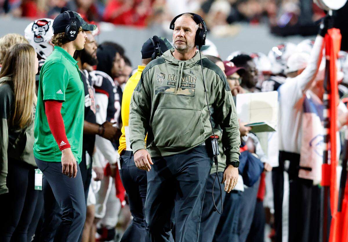 N.C. State head coach Dave Doeren walks the sideline during the first half of N.C. State’s game against Virginia Tech at Carter-Finley Stadium in Raleigh, N.C., Thursday, Oct. 27, 2022.