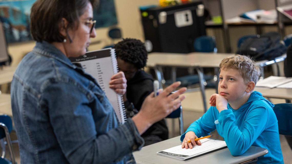 Carter Wall, right, participates in Kimberly Shaw’s sixth-grade reading class at Reddy Creek Magnet Center for Digital Sciences in Cary on Tuesday, March 4, 2025.