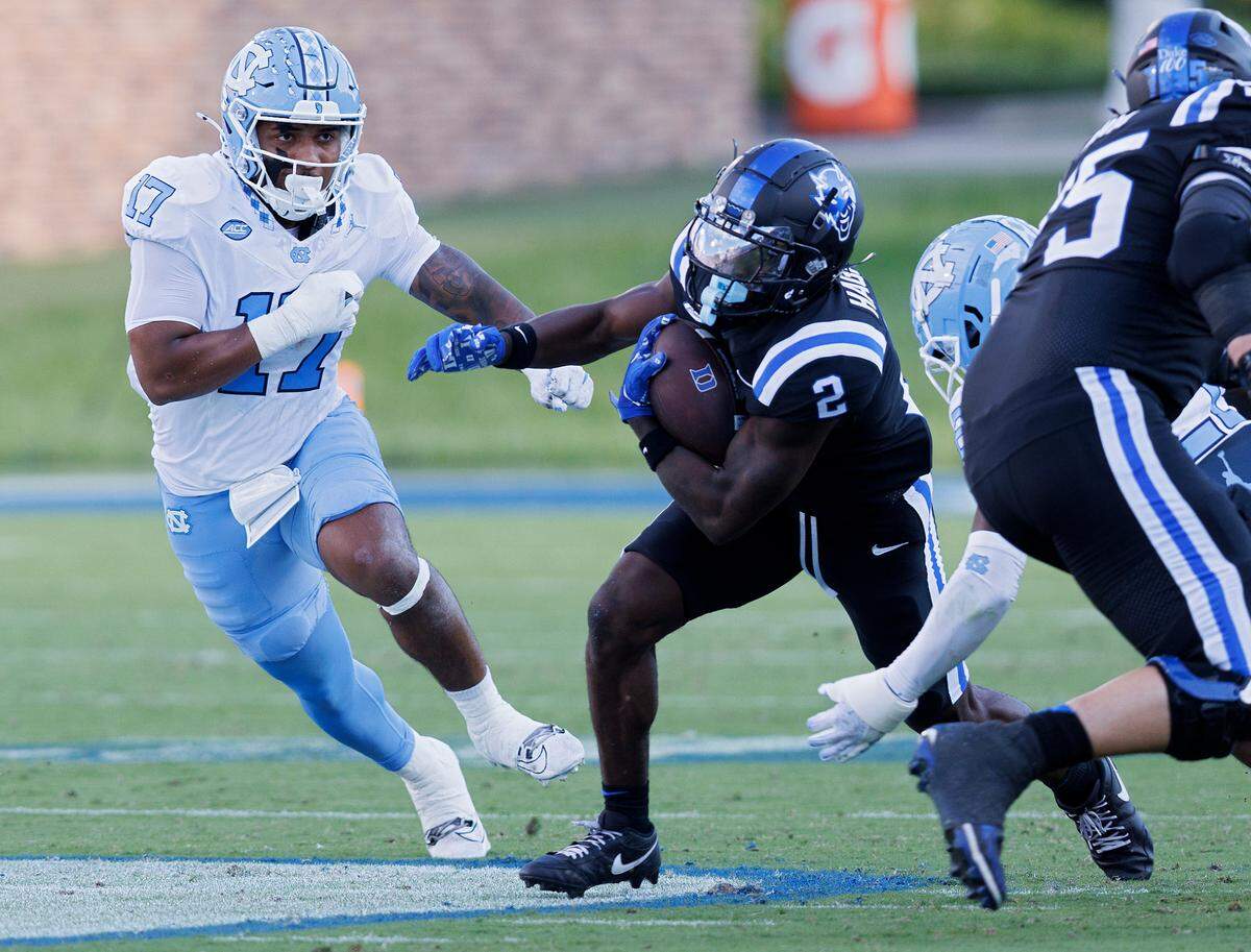 Duke’s Sahmir Hagans runs the ball past North Carolina’s Amare Campbell during the first half of the Blue Devils’ game on Saturday, Sept. 28, 2024, at Wallace Wade Stadium in Durham, N.C.