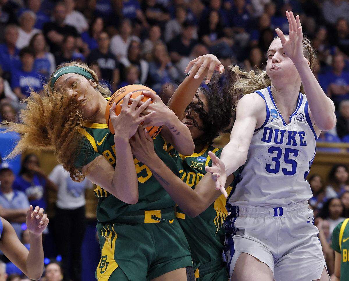 Duke’s Toby Fournier battles Baylor’s Darianna Littlepage-Buggs and Kiersten Johnson for a rebound during the second half of the Blue Devils’ 69-46 second-round NCAA Tournament win on Sunday, March 22, 2026, at Cameron Indoor Stadium in Durham, N.C.