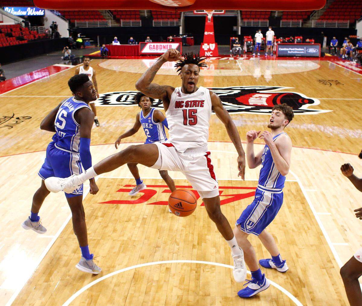N.C. State’s Manny Bates (15) reacts after slamming in two during Duke’s 69-53 victory over N.C. State at PNC Arena in Raleigh, N.C., Saturday, February 13, 2021.