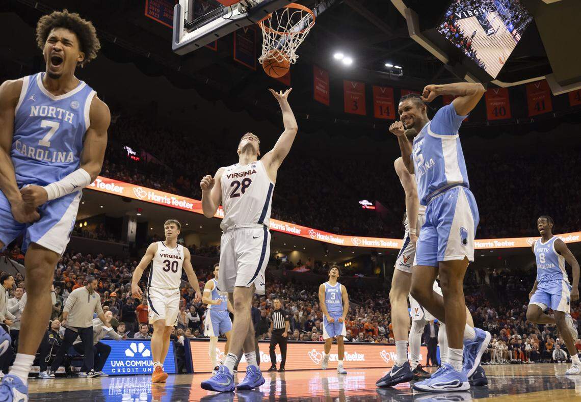 North Carolina guard Seth Trimble (7) and forward Jarin Stevenson (15) react after a basket by Trimble in the second half against Virginia on Saturday, January 24, 2026 at John Paul Jones Arena in Charlottesville, Va