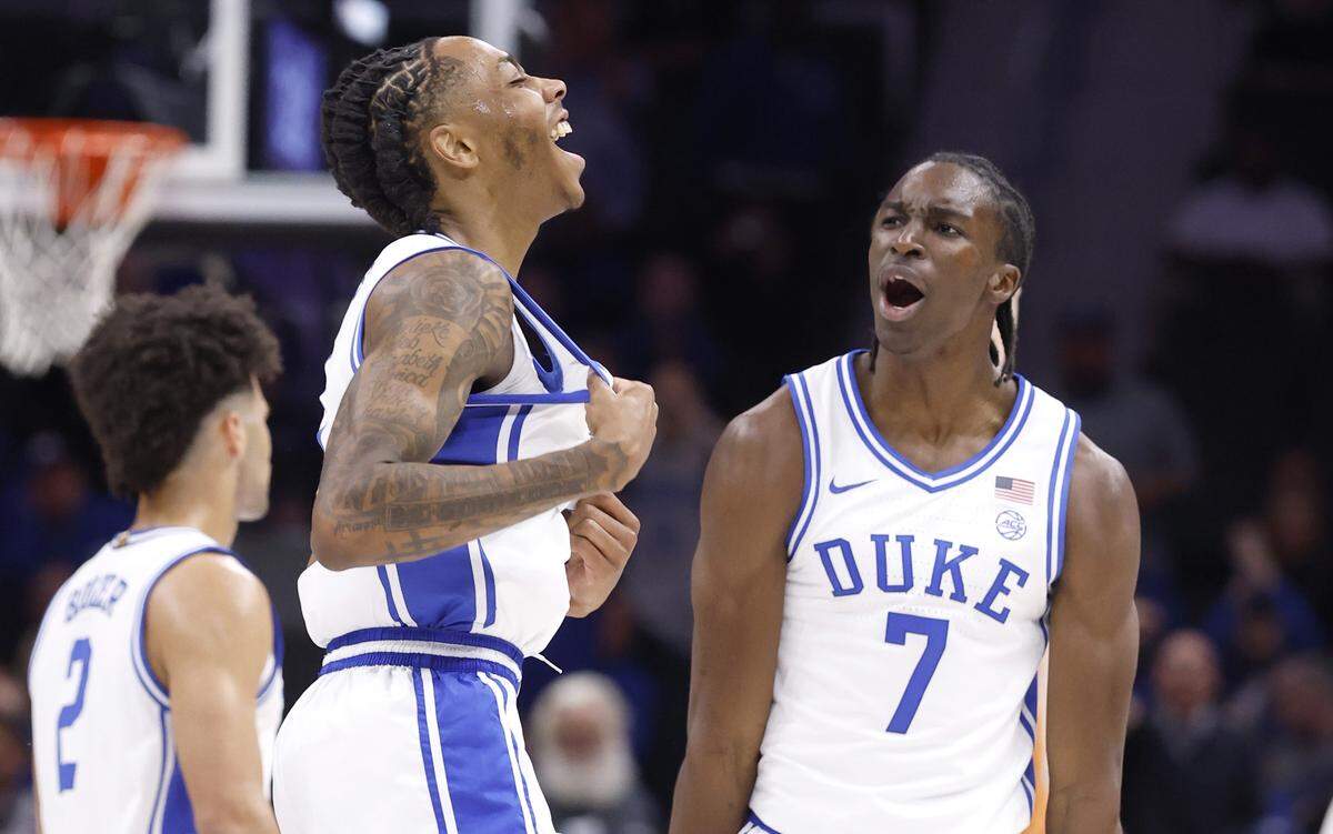Duke’s Isaiah Evans (3) and Dame Sarr (7) celebrate after Evans hit a basket in the first half of Duke’s game against Texas in the Dick Vitale Invitational at the Spectrum Center in Charlotte, N.C., Tuesday, Nov. 4, 2025.