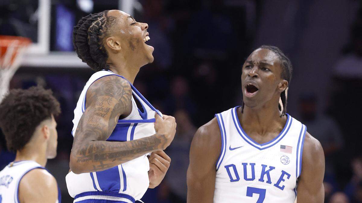 Duke’s Isaiah Evans (3) and Dame Sarr (7) celebrate after Evans hit a basket in the first half of Duke’s game against Texas in the Dick Vitale Invitational at the Spectrum Center in Charlotte, N.C., on Tuesday, Nov. 4, 2025. Against Army, Sarr exploded for 19 points and made quite an impression as Duke rolled to a win.