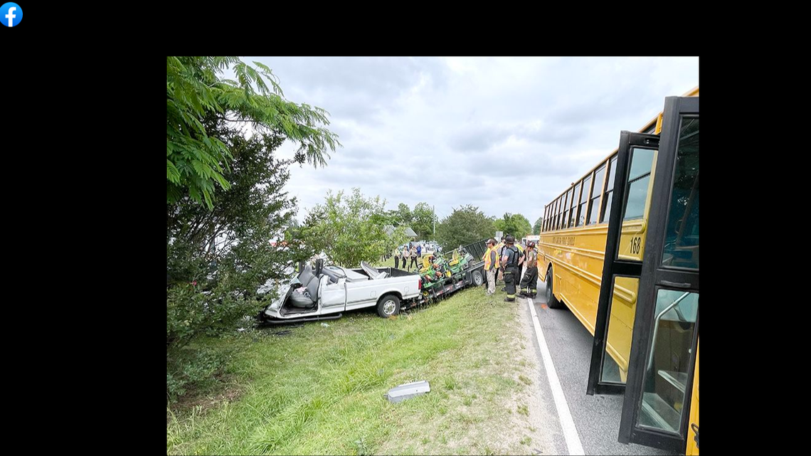 The North Carolina elementary school bus was carrying 22 students when a pickup truck collided with it, officials said.