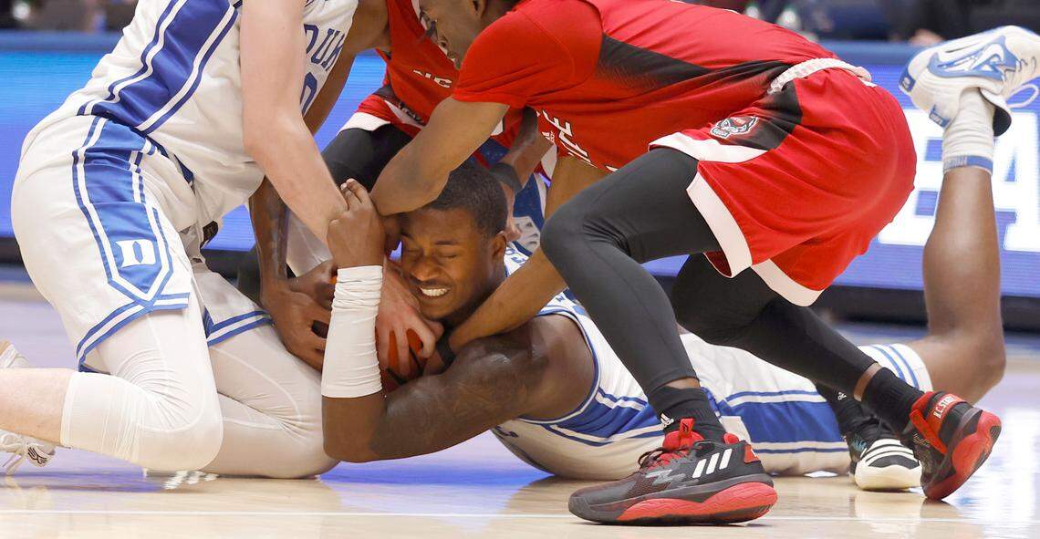 Duke’s Dariq Whitehead (0) takes control of a loose ball during the second half of Duke’s 71-67 victory over N.C. State at Cameron Indoor Stadium in Durham, N.C., Tuesday, Feb. 28, 2023.