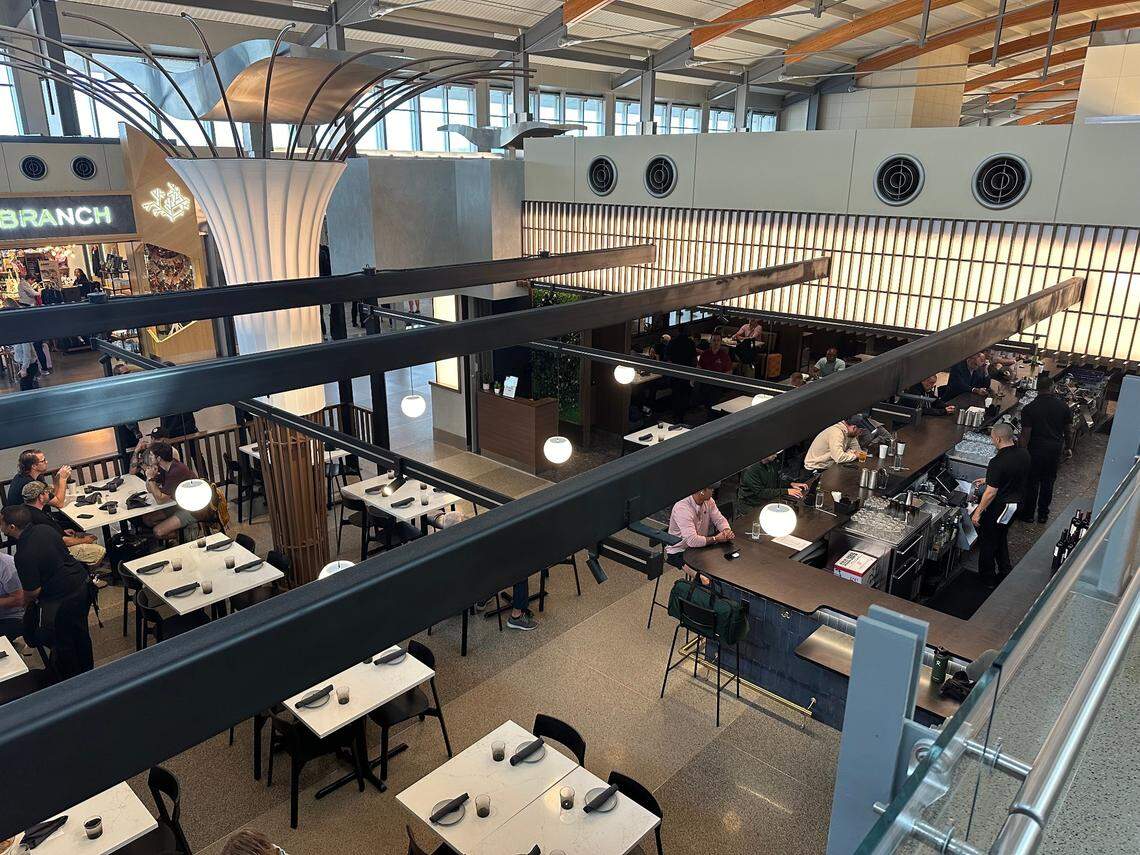 About half the seating at Crawford’s Genuine at Raleigh-Durham International Airport is in a roofless area that feels like a deck or patio. The tree-like structure left was a compromise; Scott Crawford was hoping for a real tree. Taken Sept. 18, 2024.