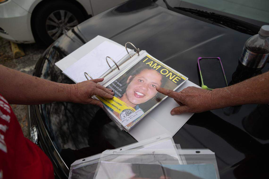 Angela Baxley shows a binder of unsolved missing indigenous persons cases. Baxley’s niece was found dead in the woods in Robeson County in 2009. Baxley is secretary of Shatter the Silence, which holds rallies and marches and supports victims’ families.