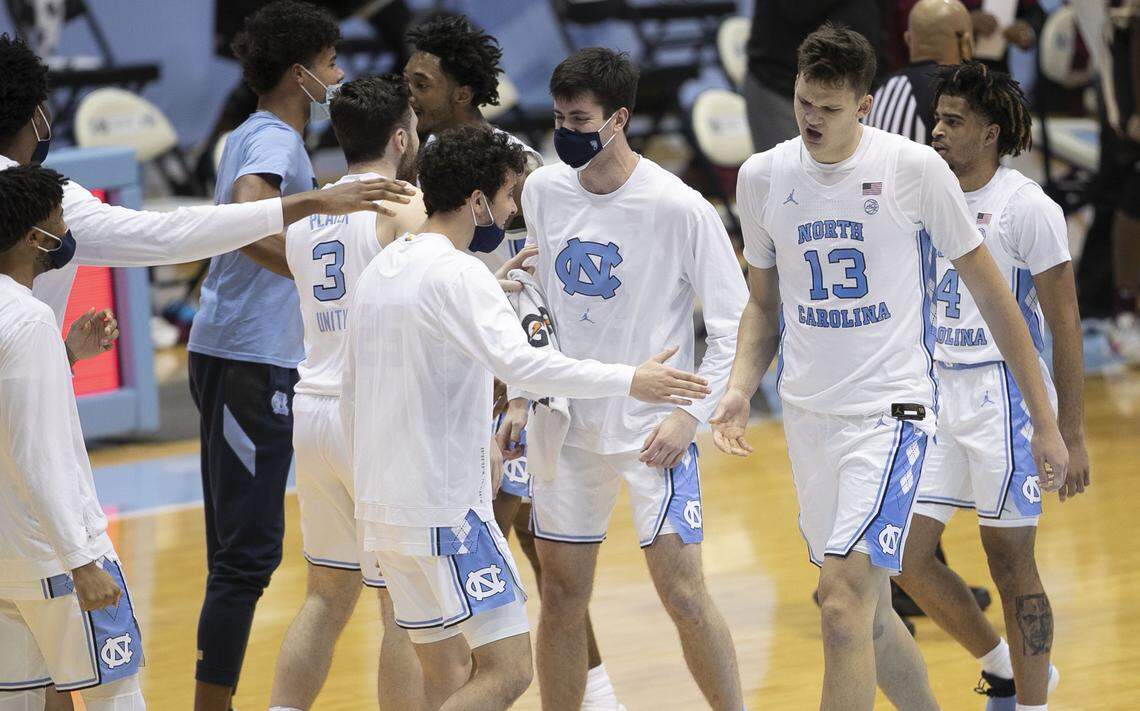 North Carolina’s Walker Kessler (13) is greeted by teammates after scoring four points and giving North Carolina a seven point lead over Florida State in the second half Saturday, February 27, 2021 in Chapel Hill, N.C.