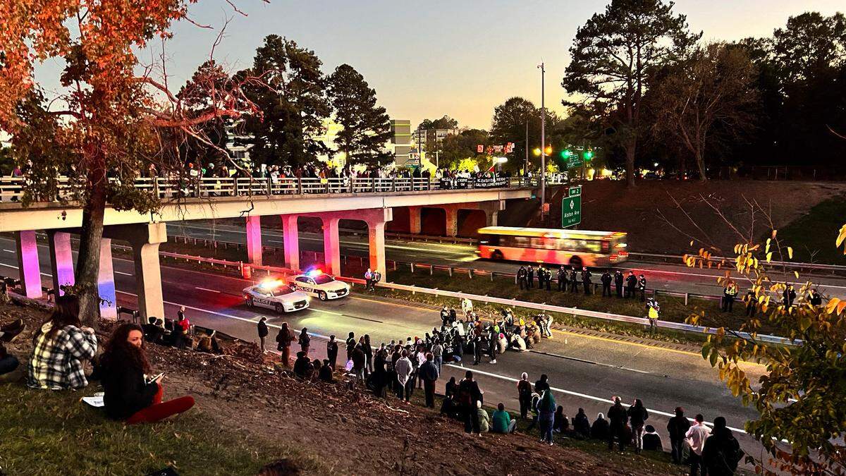 Protesters against the Israel-Gaza War continue to block two lanes of the Durham Freeway Thursday evening Nov. 2, 2023.