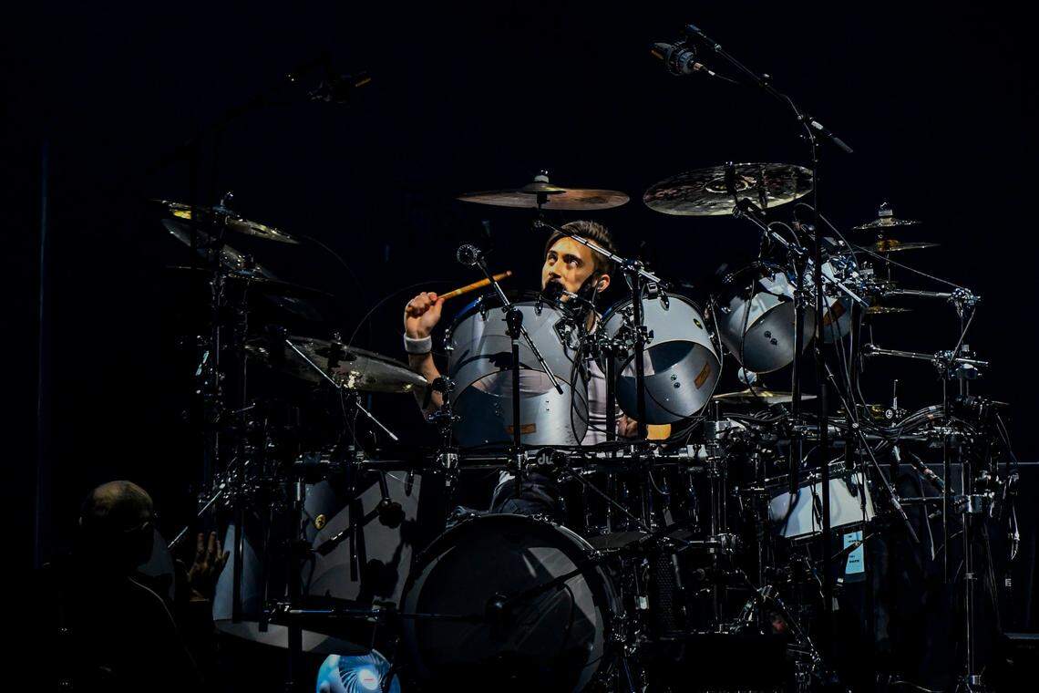 Singer Phil Collins leads Genesis as they play in their “The Last Domino?” tour at the United Center on Monday, Nov. 15, 2021, in Chicago. On drums in background is Collins’ son Nicholas Collins.
