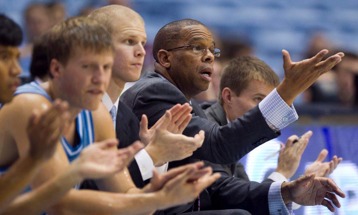 UNC JV basketball coach Hubert Davis directs his team on offense during the second half of his first game of the season against Mt. Olive at the Smith Center in Chapel Hill, N.C. on November 1, 2013.