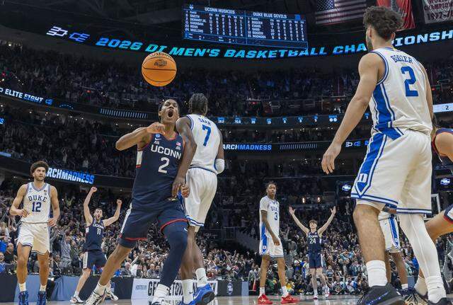 Connecticut guard Silas Demary Jr. (2) reacts along with guard Braylon Mullins (24), after Mullins’ game winning three-point basket at the buzzer to defeat Duke 73-72 on Sunday, March 29, 2026, in the NCAA East Regional Championship, at Capital One Arena in Washington, D.C.