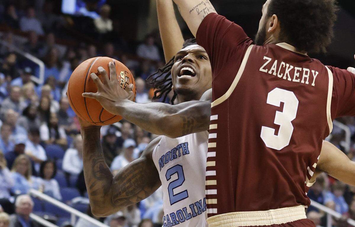North Carolina’s Caleb Love (2) heads to the basket while defened by Boston College’s Jaeden Zackery (3) during the first half of UNC’s game against Boston College in the second round of the New York Life ACC Men’s Basketball Tournament in Greensboro, N.C., Wednesday, March 8, 2023.