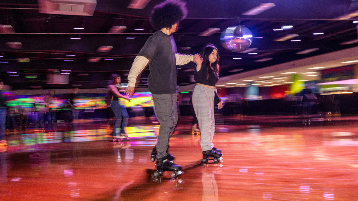Roller-skaters circle the rink of Wheels Durham roller-skating rink on Hoover Road Friday, Feb. 28, 2025 after having been closed in 2020 after four decades. In 2021, the city bought the space and began renovations after residents demanded the return of the safe space for youth in East Durham.