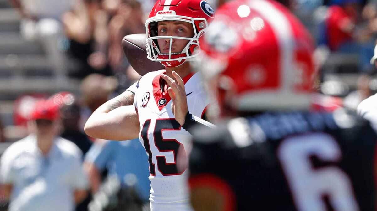 Georgia quarterback Carson Beck (15) looks to throw a pass during the G-Day spring football game in Athens, Ga., on Saturday, April 13, 2024. The game ended in a tie.