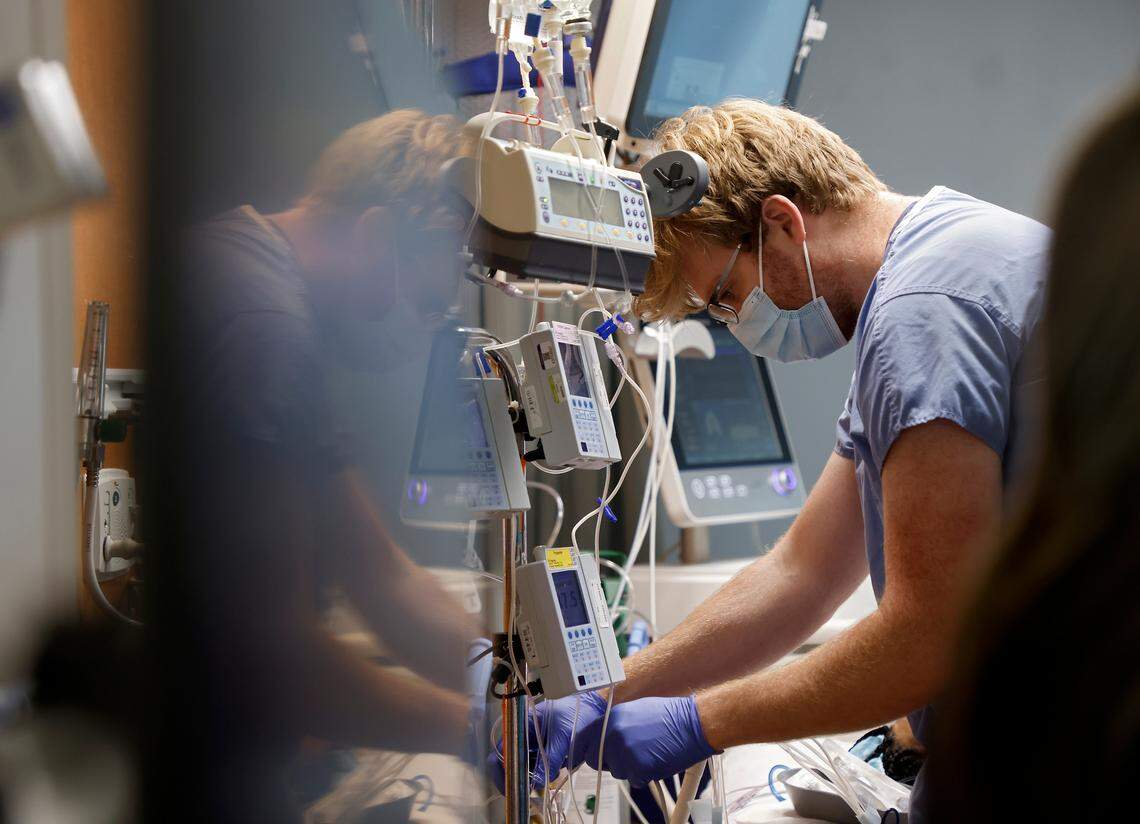 Registered nurse Matt Coleman works in a patient room on the Cardiovascular & Thoracic Intensive Care Unit at UNC Hospital on Thursday, Sept. 29, 2022, in Chapel Hill, N.C. 