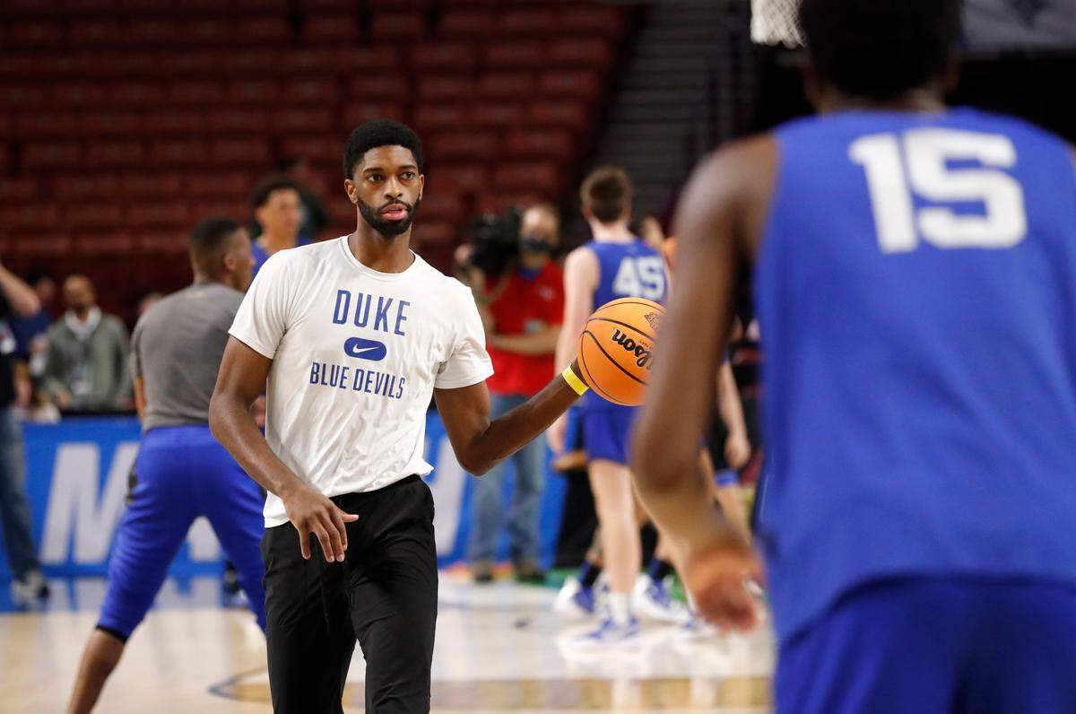 Duke’s director of player development Amile Jefferson works with the team during the Blue Devils’ open practice at the Bon Secours Wellness Arena in Greenville, S.C., Thursday, March 17, 2022.