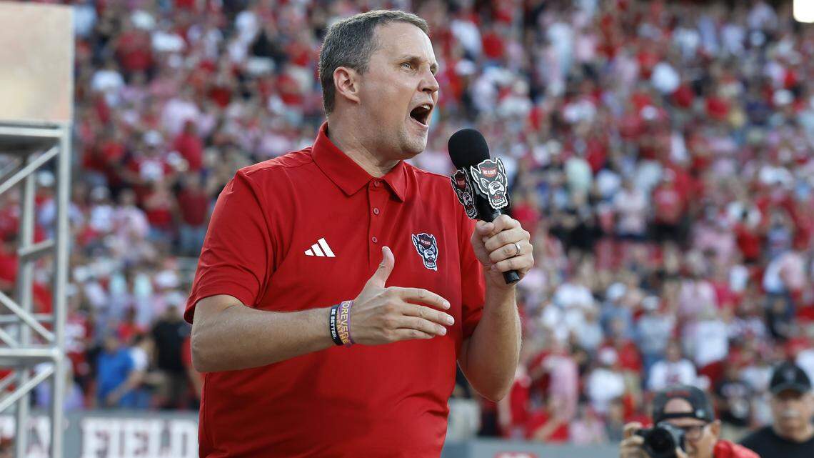 N.C. State basketball coach Will Wade pumps the crowd up before Wolfpack’s game against ECU at Carter-Finley Stadium in Raleigh, N.C., Thursday, August 28, 2025.
