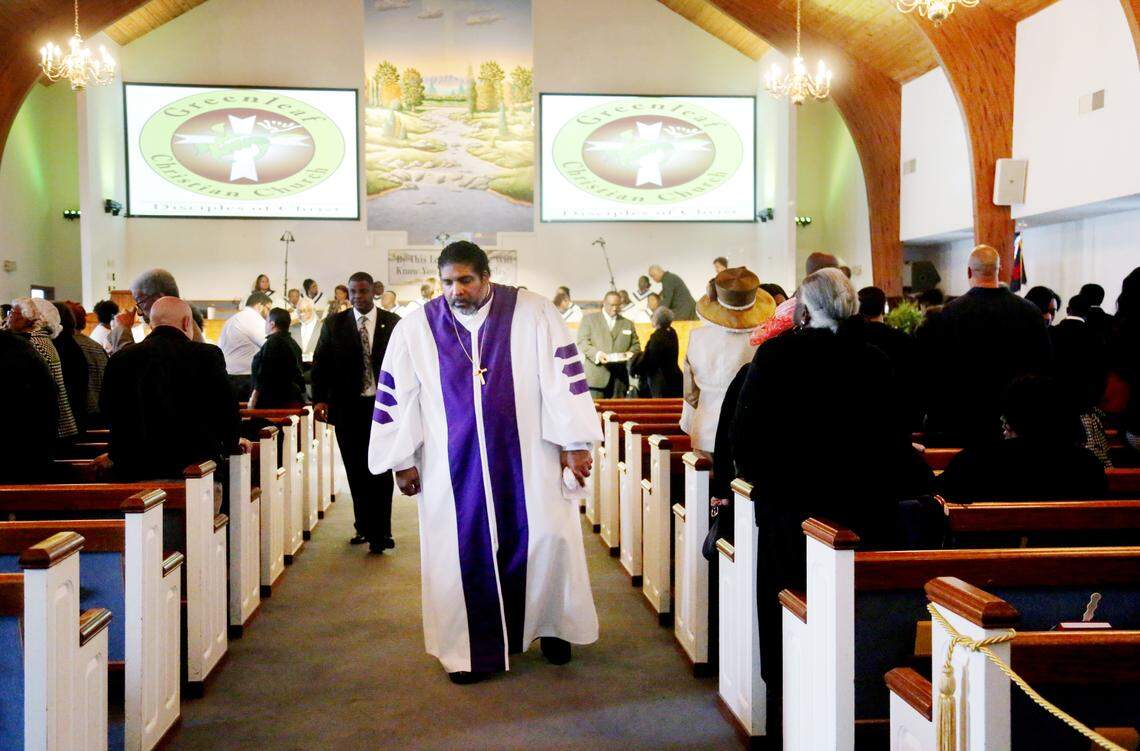Rev. Dr. William J. Barber II leaves the vestibule after the service at his Goldsboro church, Greenleaf Christian Church, Sunday, Nov. 18, 2018.