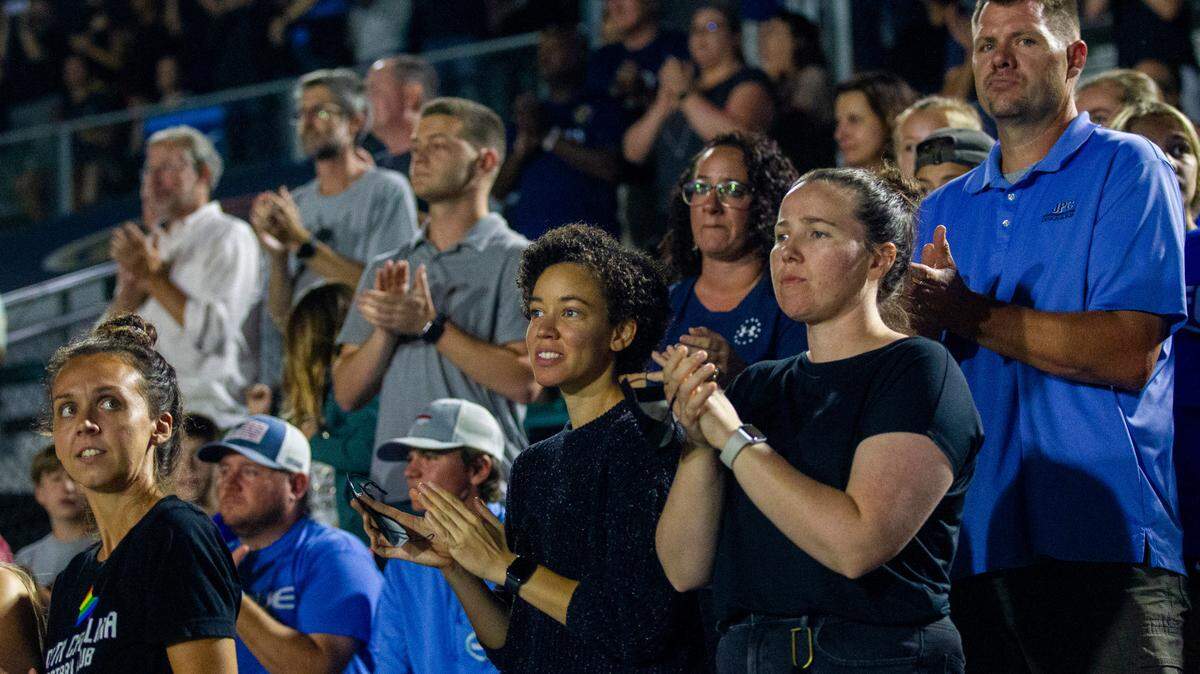 Fans stand and applaud as North Carolina Courage and Racing Louisville players form a circle and force a sixth-minute stoppage to show solidarity and protest alleged sexual abuse in the NWSL Wednesday, Oct. 6, 2021 at WakeMed Soccer Park in Cary. The NC Courage fired coach Paul Riley Thursday after former players have come forward to accuse him of sexual coercion and the NWSL’s player’s union called for an investigation.