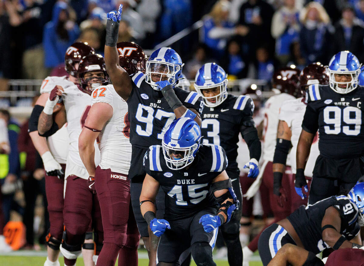 Duke’s Wesley Williams and Ozzie Nicholas react following a defensive stop during the first half of the Blue Devils’ 31-28 win over Virginia Tech on Saturday, Nov. 23, 2024, at Wallace Wade Stadium in Durham, N.C.