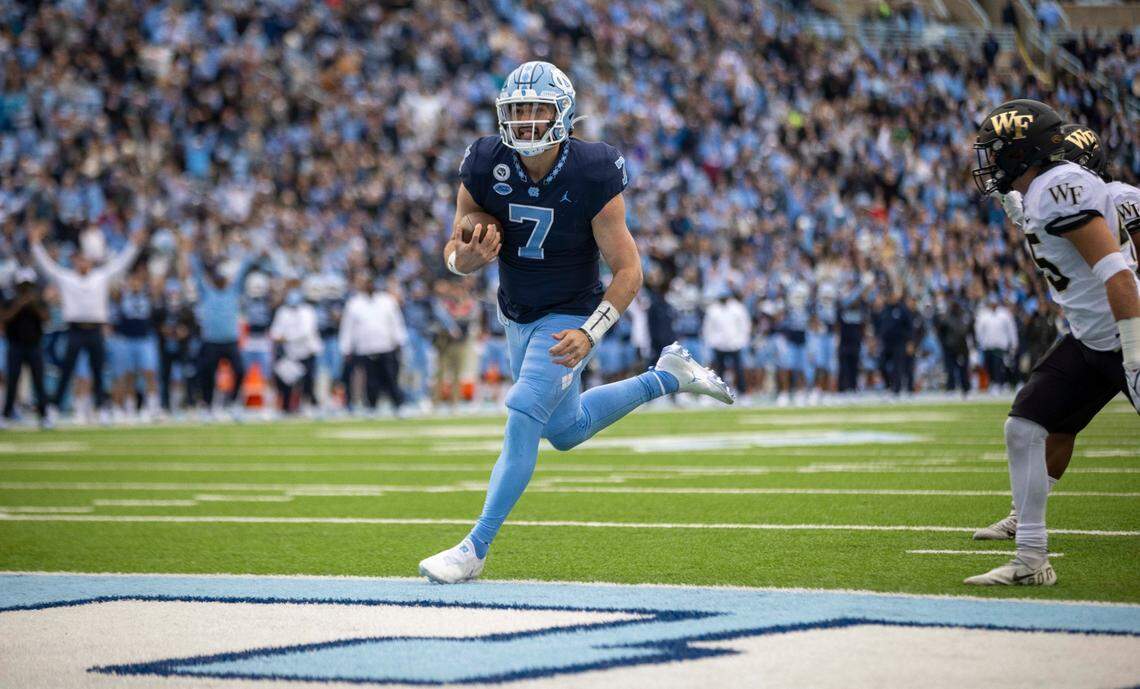 North Carolina quarterback Sam Howell (7) scores a touchdown on an 12-yard run in the first quarter to give the Tar Heels a 14-10 lead over Wake Forest on Saturday, November 6, 2021 at Kenan Stadium in Chapel Hill, N.C.