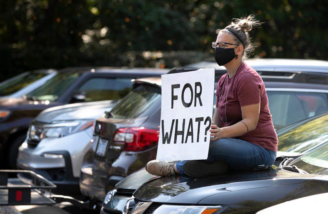Dr. Becca Kimball from Carroll Middle School joined fellow teachers to demonstrate against Wake County’s proposed reopening of schools for in-person learning outside the Wake County Public Schools’ building on Dillard Drive in Cary, N.C. on Tuesday, October 6, 2020.
