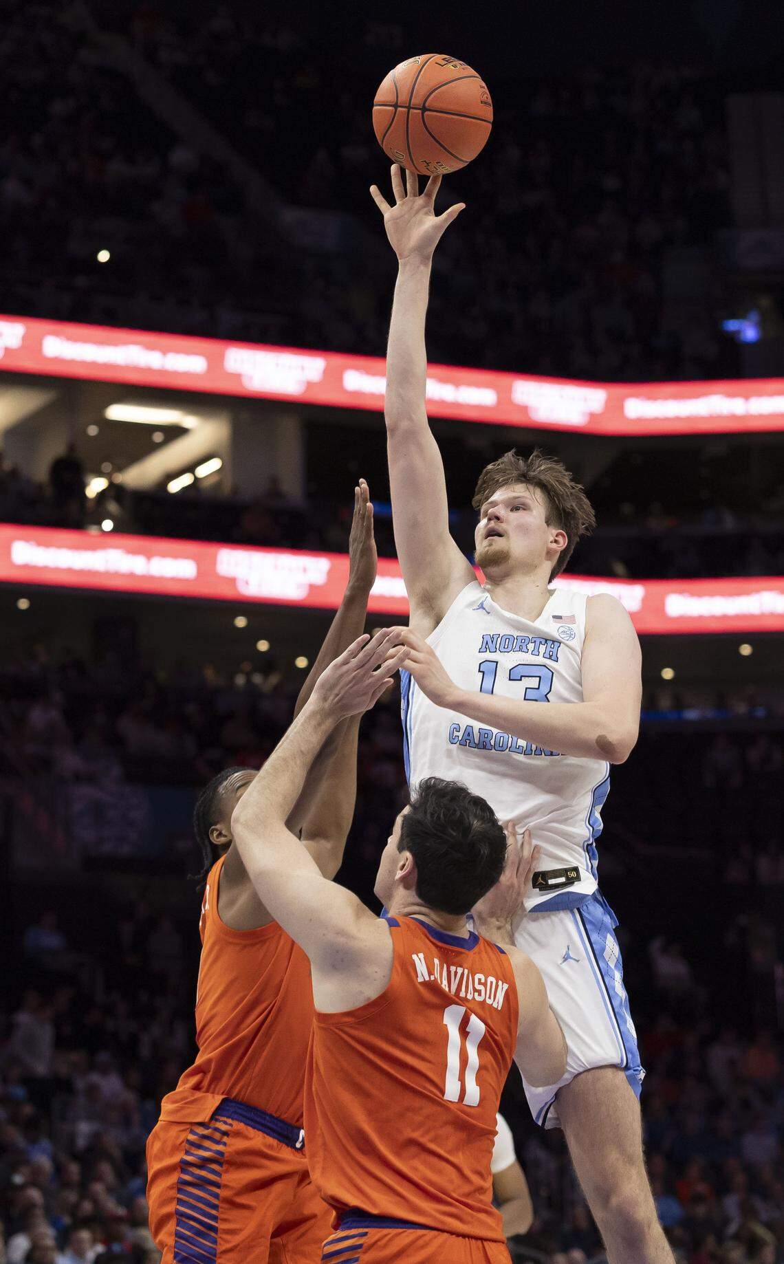 North Carolina center Henri Veesaar (13) puts up a shot over Clemson’s Nick Davidson (11) in the first half on Thursday, March 12, 2026, during the quarterfinals of the ACC Tournament at Spectrum Center in Charlotte, N.C.