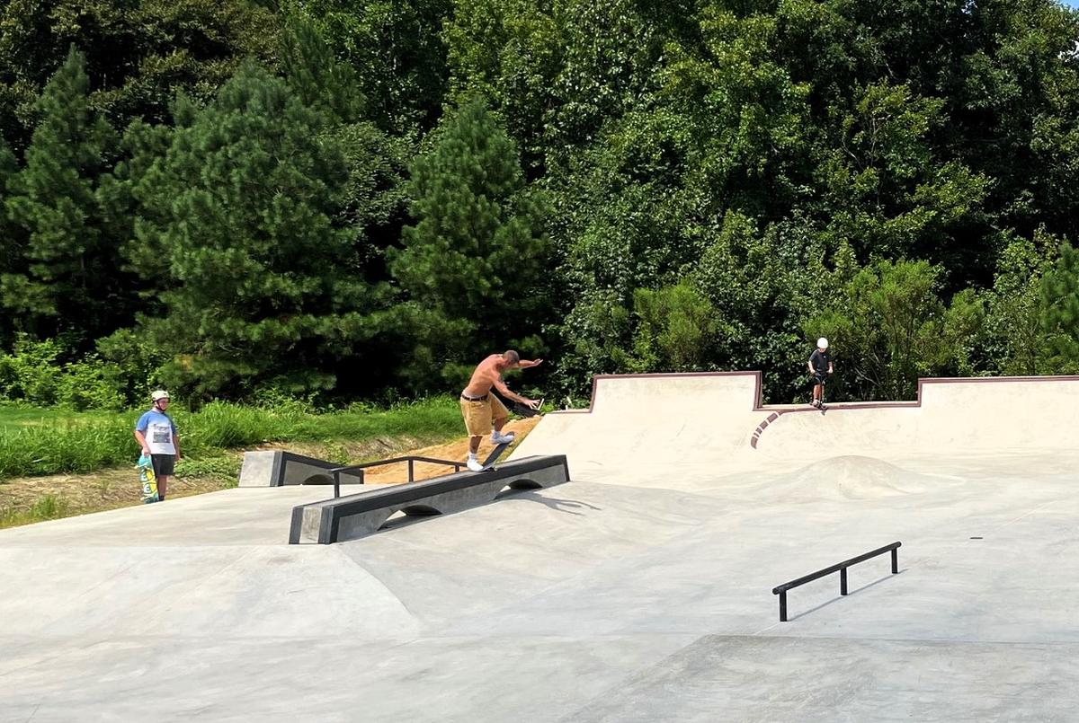 A skateboarder rides the rails on Monday, Aug. 12, 2024, at Hillsborough’s Skate Spot, located in Cates Creek Park in the Waterstone development in Hillsborough, N.C.