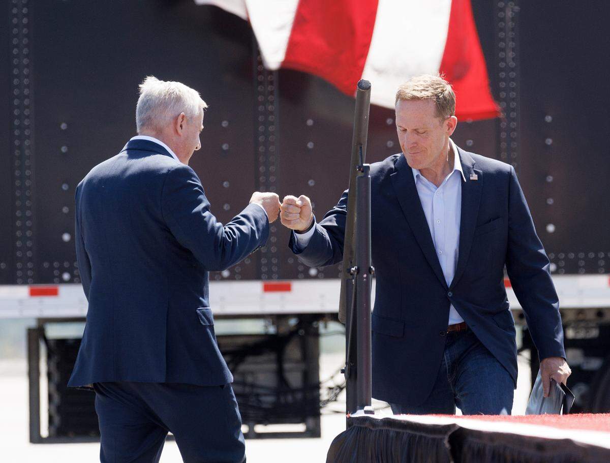 Michael Whatley, chair of the Republican National Committee, fist bumps U.S. Sen. Ted Bud during a rally in support of former President and current Republican candidate for president Donald Trump in Wilmington, N.C. on Saturday, Sept. 21, 2024.