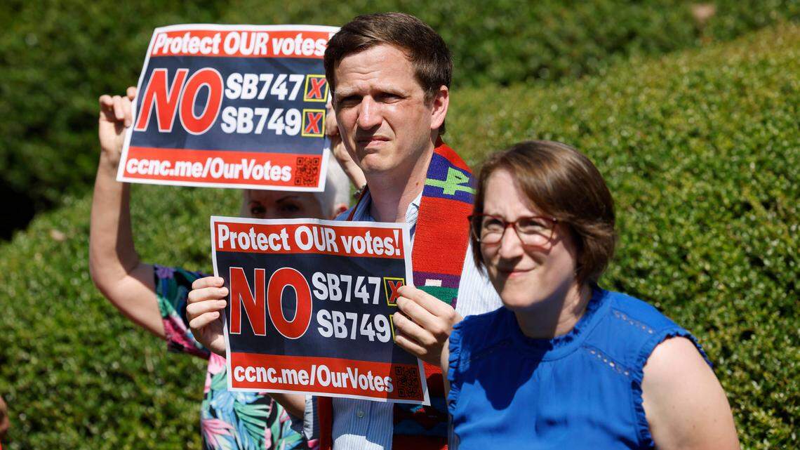 Rob Stephens, an ordained minister with the United Church of Christ, and Ann Webb, policy director for Common Cause NC, listen during a press conference outside the N.C. Legislative building Tuesday, Sept. 5, 2023. The press conference was to voice opposition to Senate Bill 749 which creates evenly-split election boards across the state and allows the legislature, rather than the governor to appoint members.