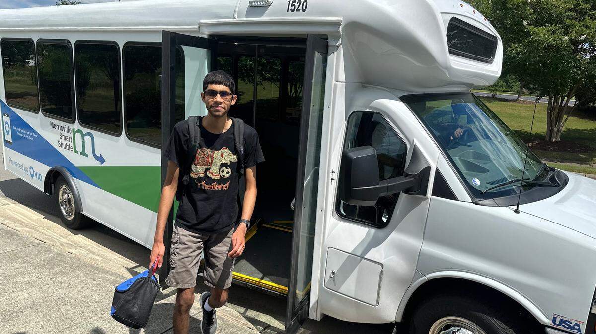 Prabhav Mamidi gets off a Morrisville Smart Shuttle on June 10. Mamidi, 20, takes the free shuttle home from classes at Wake Technical Community College’s RTP campus.