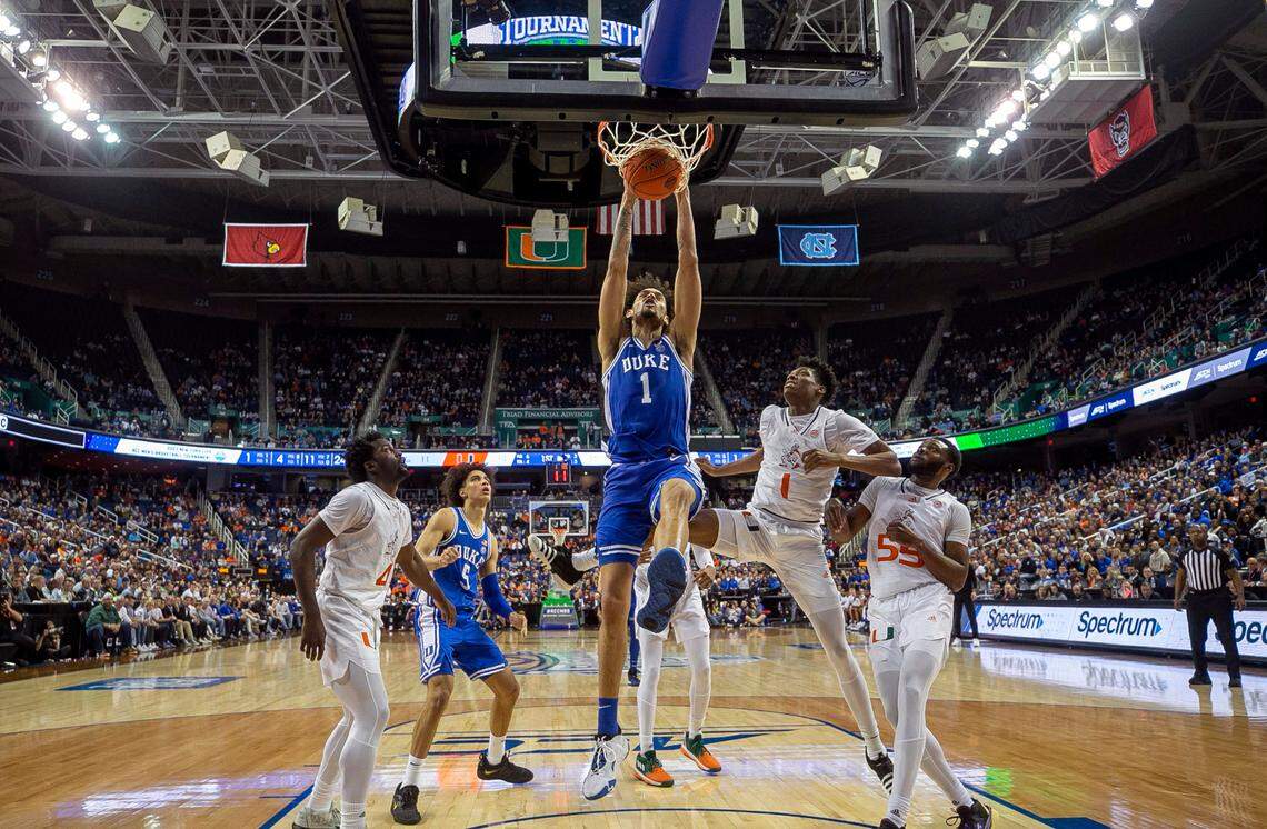 Duke’s Dereck Lively II (1) gets a dunk against Miami’s Anthony Walker (1) during the first half during in the semi-finals of the ACC Tournament on Friday, March 10, 2023 at the Greensboro Coliseum in Greensboro, N.C.