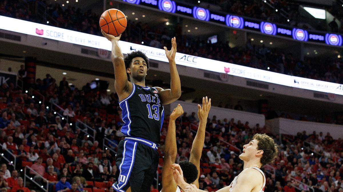 Duke’s Sean Stewart shoots over N.C. State’s Casey Morsell and Ben Middlebrooks during the second half of the Blue Devils’ 79-64 win on Monday, March 4, 2024, at PNC Arena in Raleigh, N.C.
