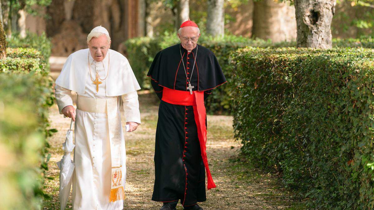Anthony Hopkins, left, and Jonathan Pryce in the Netflix original film “The Two Popes.”