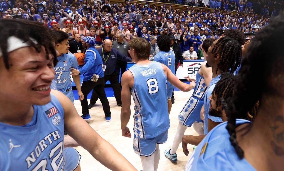 North Carolina players motion to the Cameron Crazies after UNC’s 84-79 victory over Duke at Cameron Indoor Stadium in Durham, N.C., Saturday, March 9, 2024.