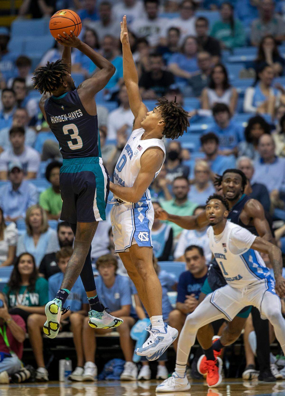 North Carolina’s Seth Trimble (0) defends UNC Wilmington’s Maleeck Harden-Hayes (3) in the second half on Monday, November 7, 2022 at the Smith Center in Chapel Hill, N.C.