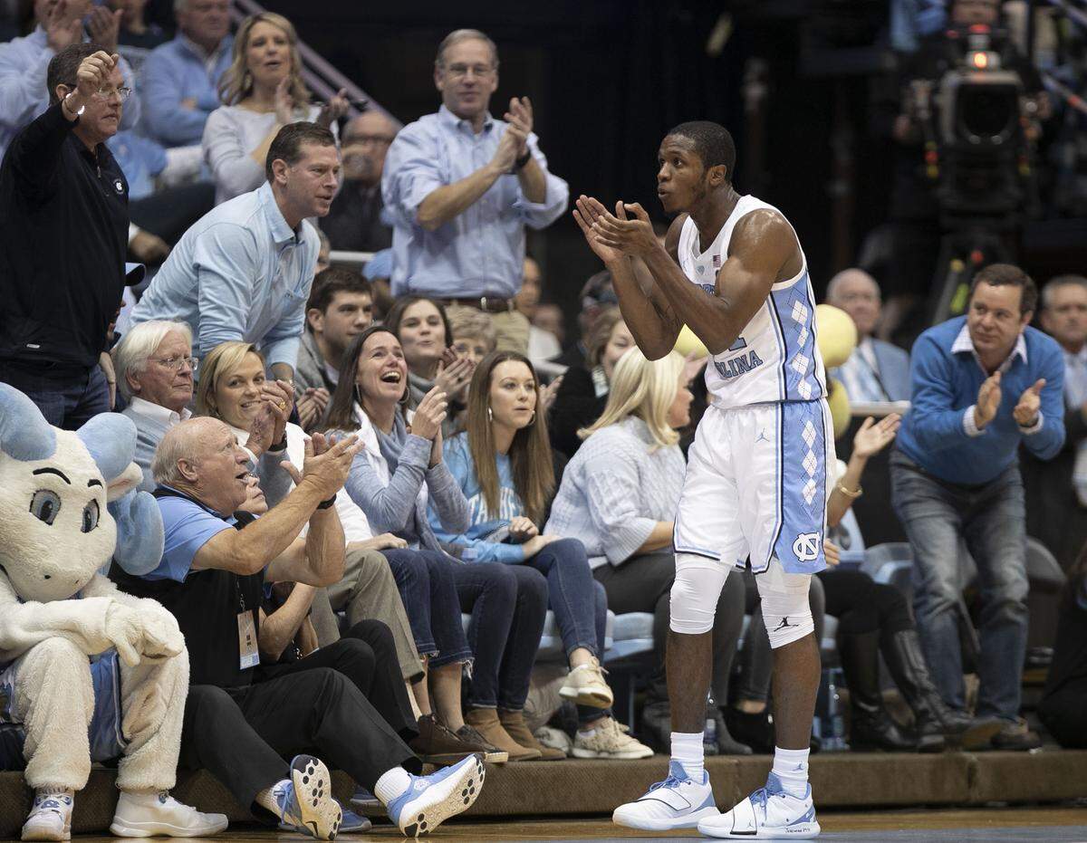 North Carolina’s Kenny Williams (24) tries to gets the crowd fired up after forcing a turnover by Louisville during the first half on Saturday, January 12, 2019 at the Smith Center in Chapel Hill, N.C.