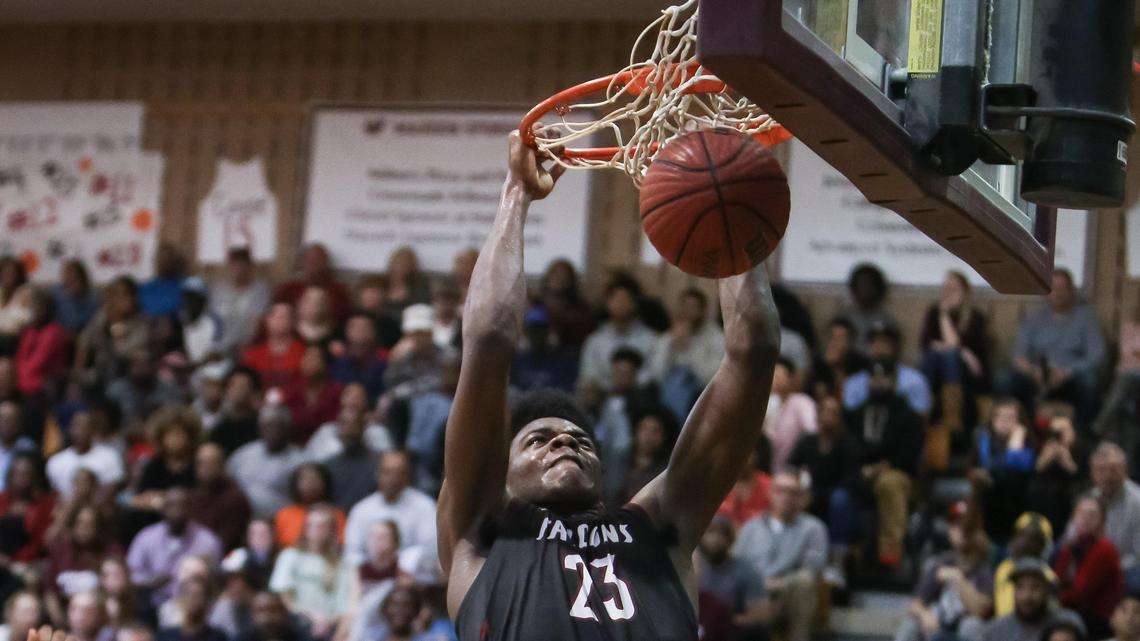 South Central’s Day’ron Sharpe (23) dunks during South Central’s playoff game at Wakefield on Tuesday, March 5, 2019.