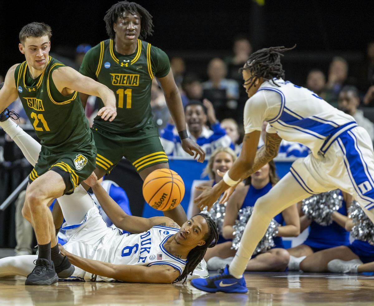 Duke forward Maliq Brown (6) recovers a loose ball and passes to forward Isaiah Evans (3) in the second half against Siena on Thursday, March 18, 2026, during the first round of the NCAA Tournament at Bon Secours Arena in Greenville, S.C. 