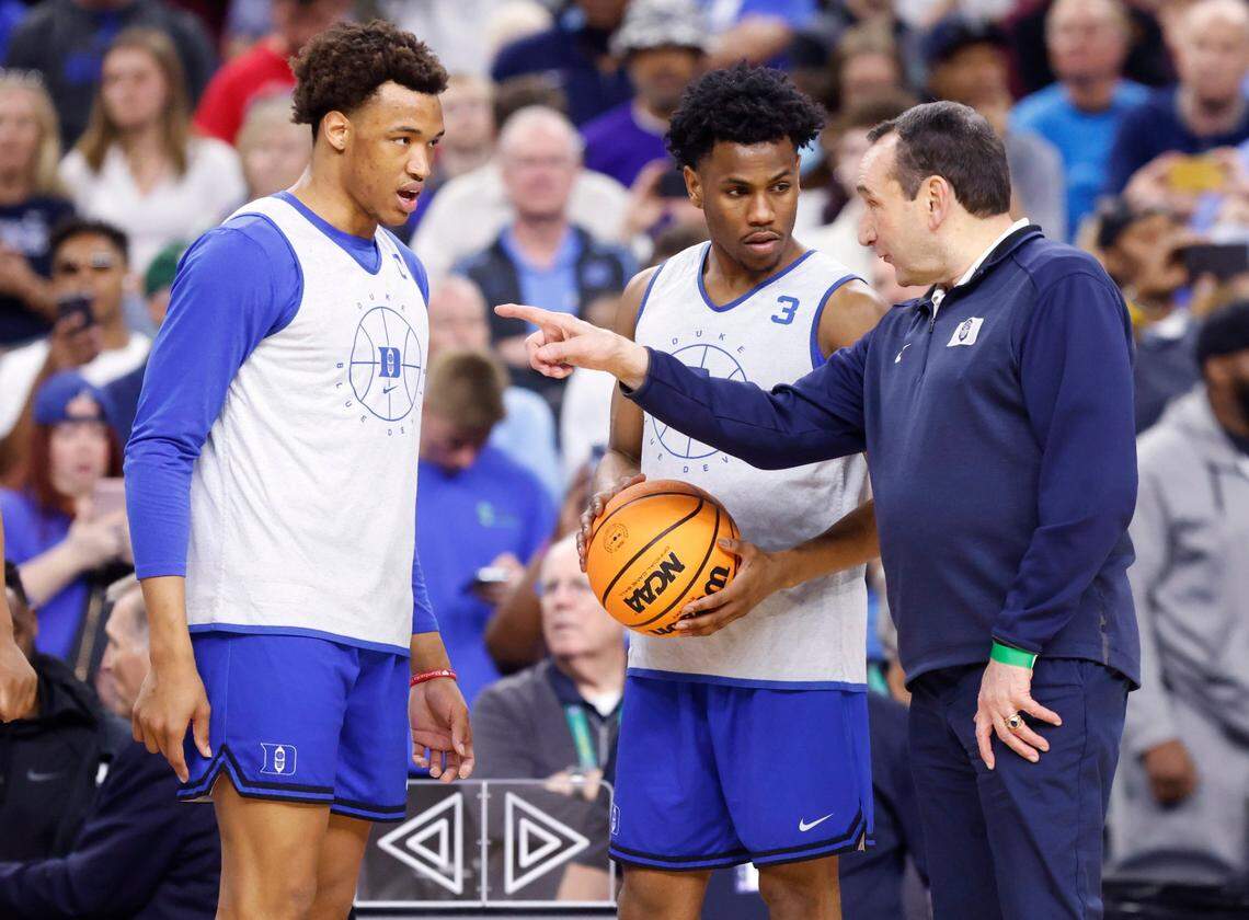 Duke head coach Mike Krzyzewski talks with Wendell Moore Jr. (0) and Jeremy Roach (3) during Dukes open practice at the Caesars Superdome in New Orleans, La., Friday, April 1, 2022. North Carolina will face Duke in the Final Four Saturday.