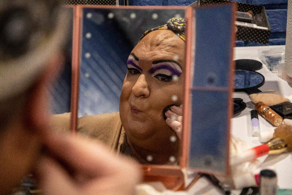 Brenda the 7-foot drag queen from Greensboro gets ready backstage before hosting North Carolina’s oldest running drag show, Green Queen Bingo, which dates to 2004 and regularly fills Piedmont Hall in Greensboro.