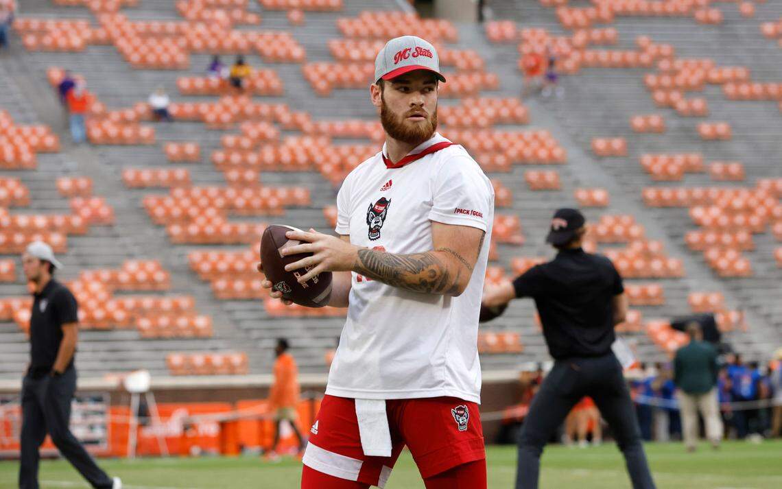 N.C. State quarterback Devin Leary (13) warms up before N.C. State’s game against Clemson at Memorial Stadium in Clemson, S.C., Saturday, Oct. 1, 2022.