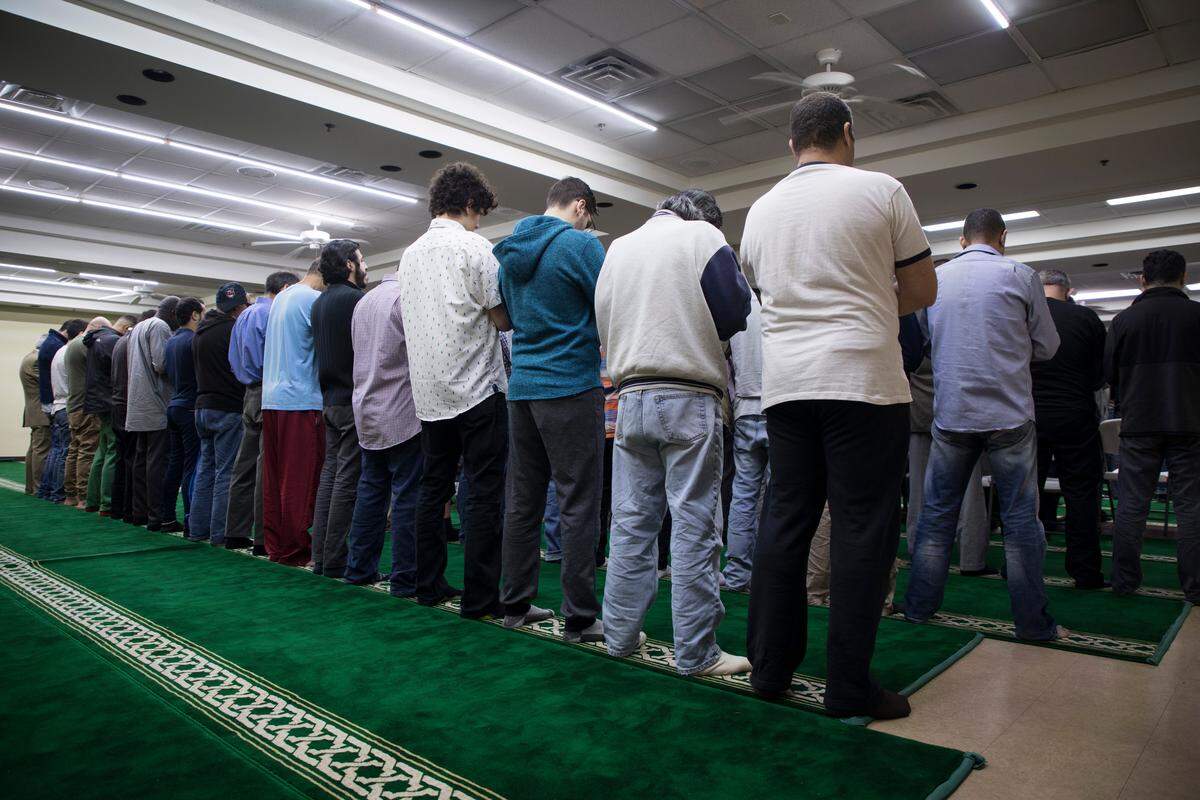 Members of the Islamic Association of Raleigh listen to service on Friday, March 15, 2019.
