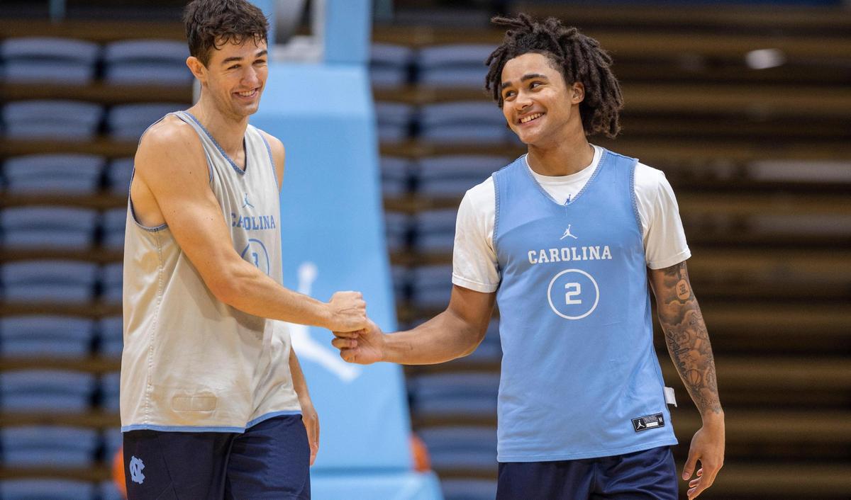 North Carolina’s Cormac Ryan (3) fits bumps teammate Elliott Cadeau (2) during the Tar Heels’ practice on Friday, October 6, 2023 at the Dean Smith Center in Chapel Hill, N.C.