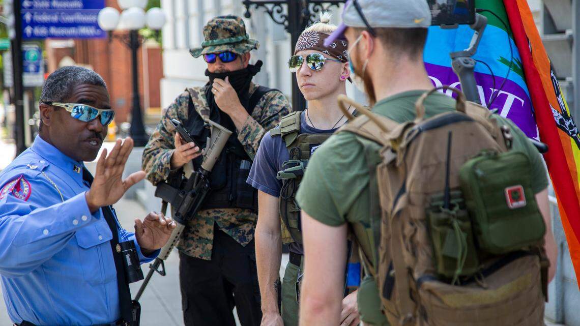 Marchers with guns return to downtown Raleigh streets, draw counter-protests